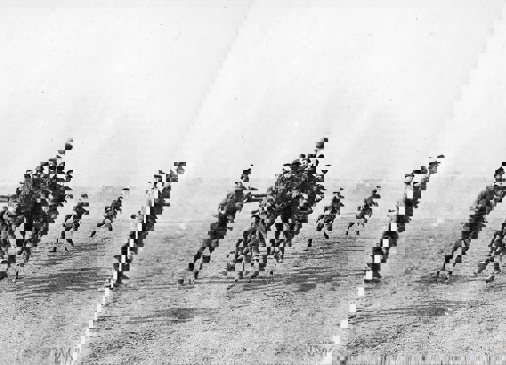 WW1 British soldiers playing a game of football in Salonika, Christmas Day, 1915.