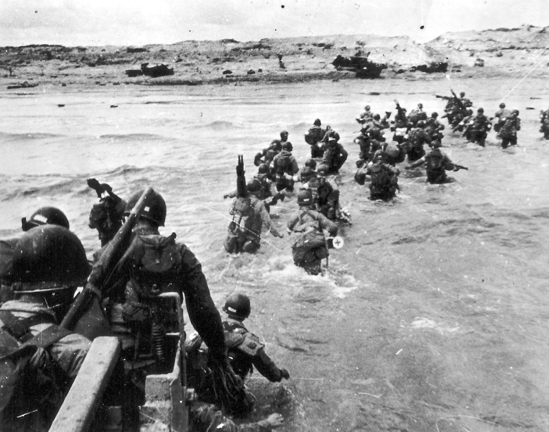 American soldiers wading through the water on Utah Beach, D-Day.