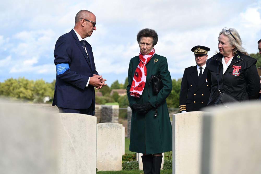 HRH Princess Anne, CWGC Head of Commemorations, and CWGC Director General inspect headstones at Loos British Cemetery.