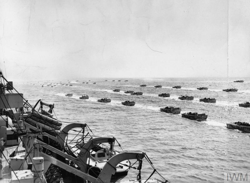 A fleet of landing craft sailing on the English Channel.