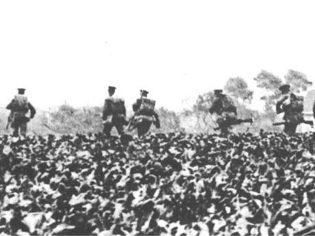 British troops retreating through a field after the Battle of Mons