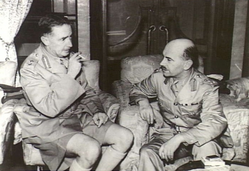 Brigadier Lawson confers with Brigadier-General Maltby in an office during the battle for Hong Kong.