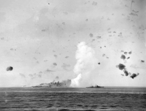 A terrific explosion sends seawater high in a huge splash during at an attack on HMS Indomitable.