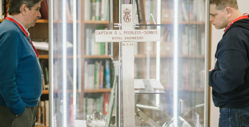 A wooden cross in a display cabinet at CWGC's head office.