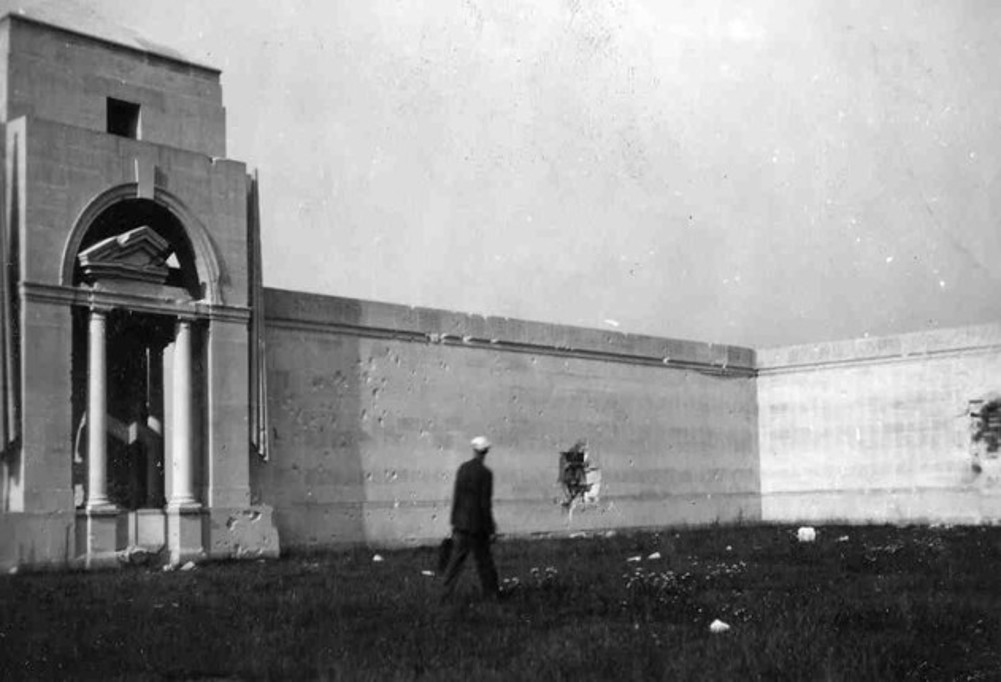 Shell and bullet holes in the curtain wall and name panels at the Villers-Bretonneux Memorial.