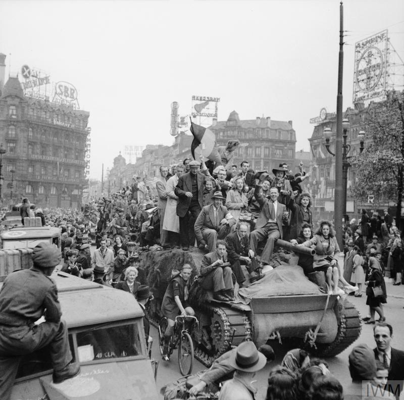 British Sherman Tank mobbed by grateful civilians in Brussels following the city's liberation in September 1944.