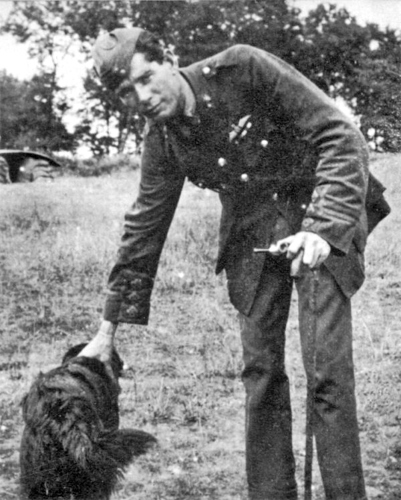 Edward Mannock VC poses with his pet dog.