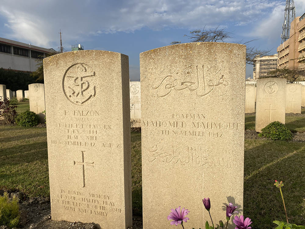 Two headstones in Alexandria (Hadra) War Memorial Cemetery. To tthe left is a British Royal Navy casualty; to the right is the headstone of a Muslim soldier, complete with Arabic script.