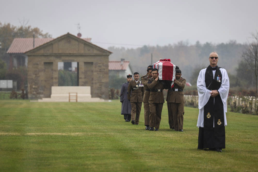 The bearer party slow march through the Arezzo War Cemetery.