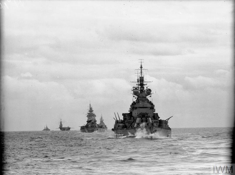 Royal Navy convoy featuring battleships and an aircraft carrier sailing during the Second World War.