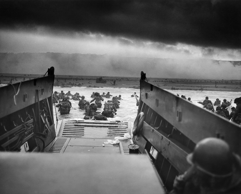 Into the Jaws of Death photograph from Robert Capa showing US assault on Omaha Beach, D-Day.