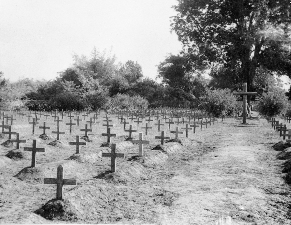 Wooden grave markers mark the war graves of fallen soldiers in Chungkai War Cemetery.