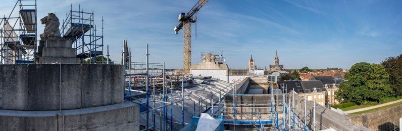 Panoramic view from the Menin Gate roof showing scaffolidng, crane, and wider views of Ypres.