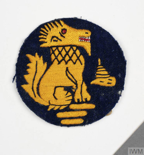 Patch of a Chindit badge, showing a stylised mythical lion sewn in gold on a black circular background